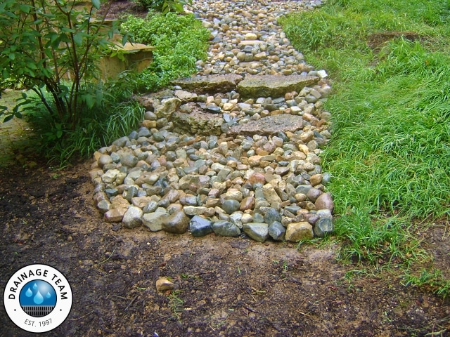 Decorative Rock Drainage Swale | Outdoor Drainage Contractors