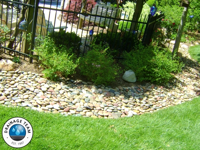 Decorative Rock Drainage Swale | Outdoor Drainage Contractors
