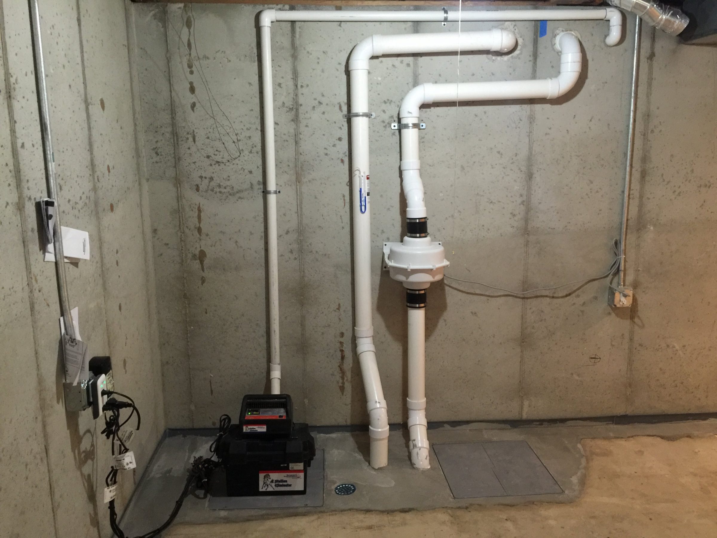 Basement sump pump and PVC drainage pipes