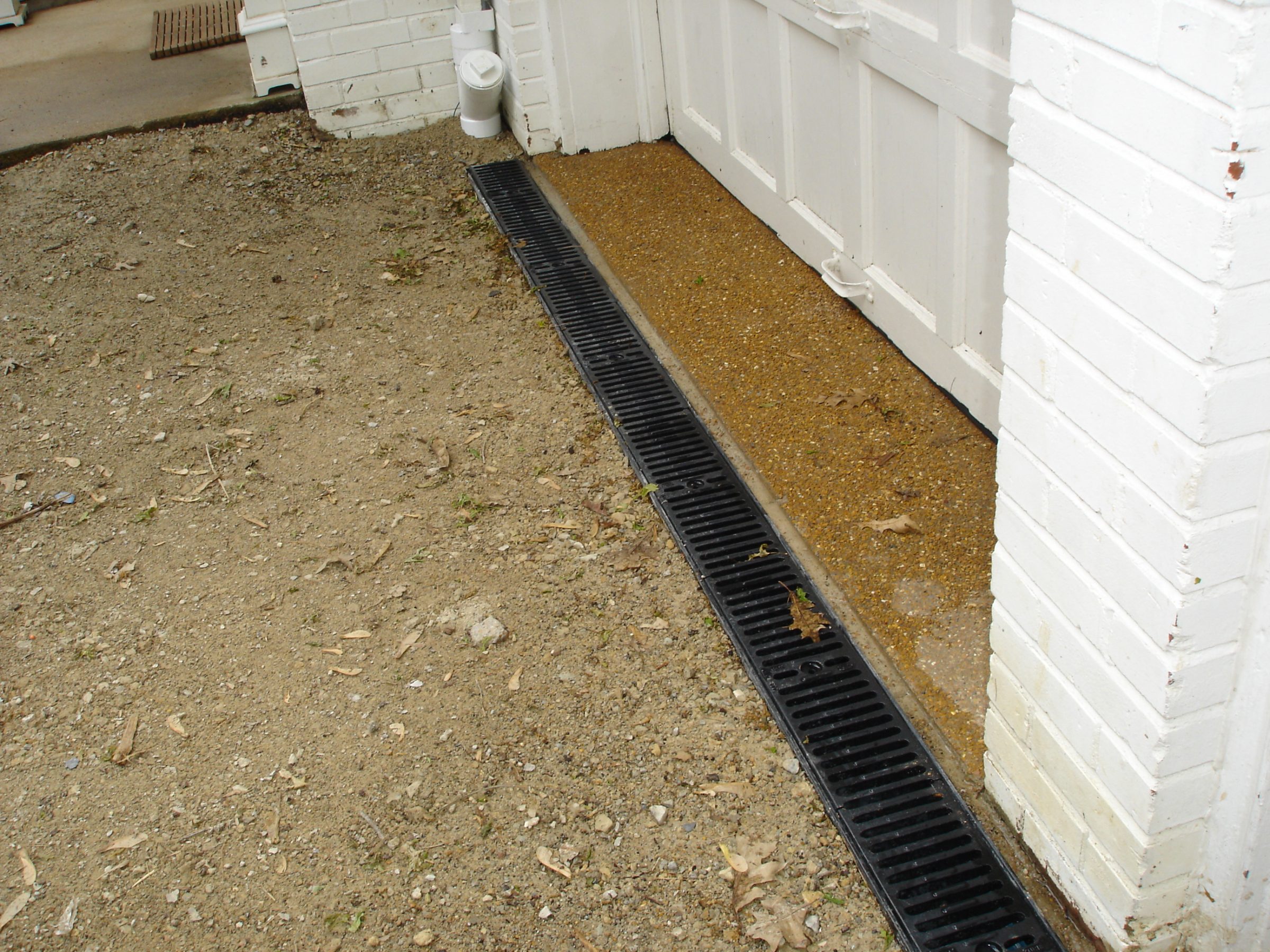 Linear trench drain along garage entrance