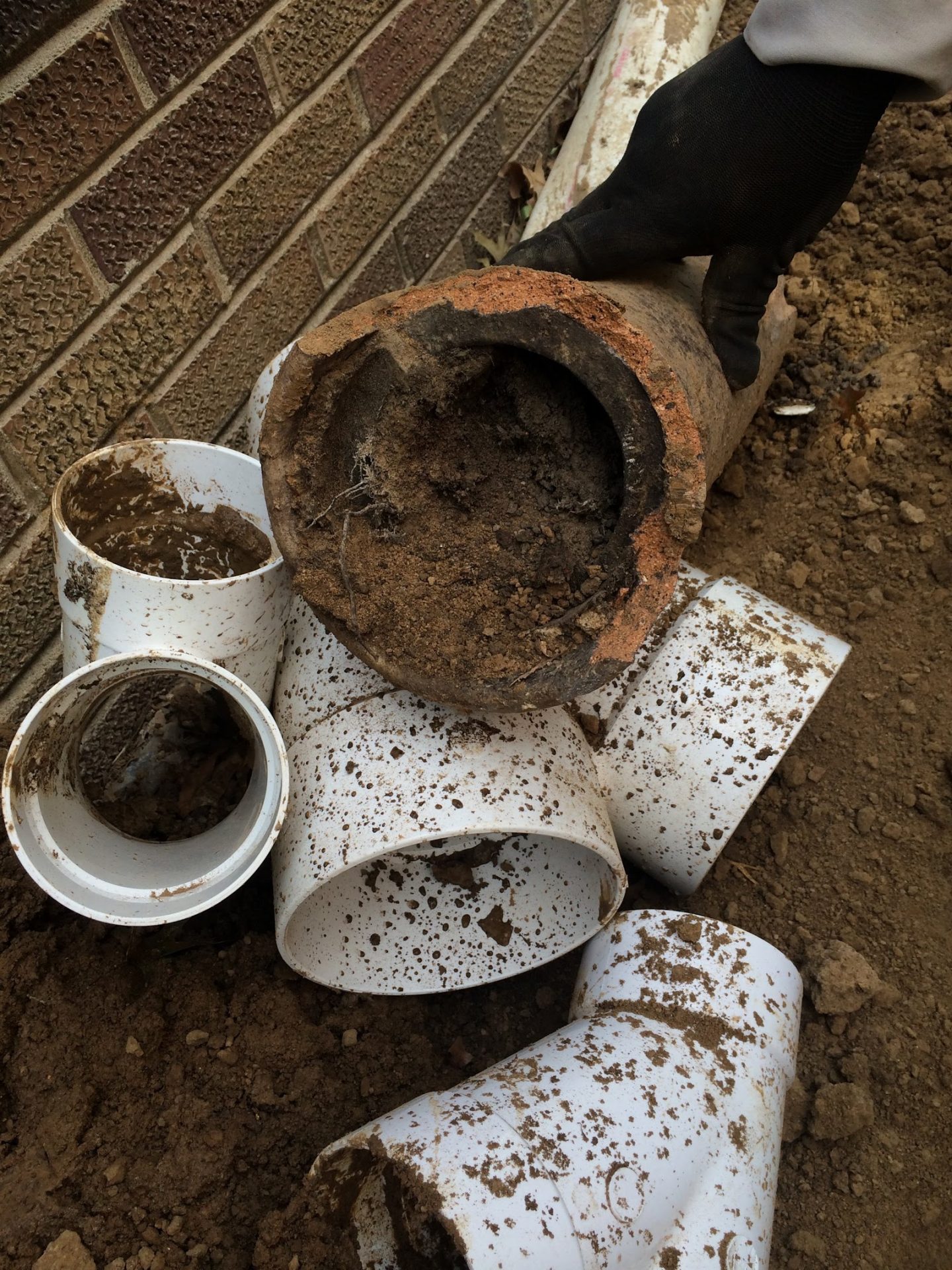 Clogged clay drain pipe during plumbing repair