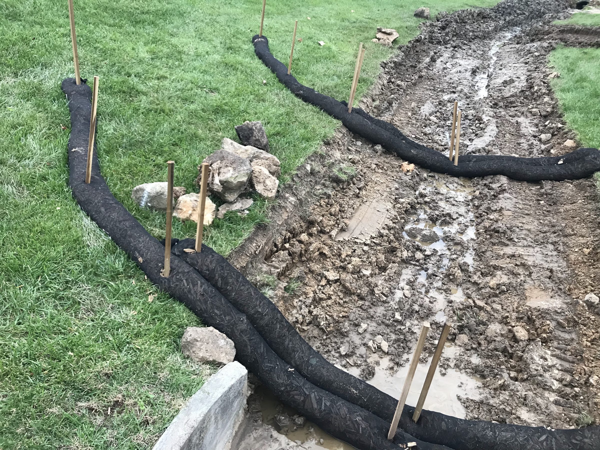 Silt fences surrounding muddy excavation site
