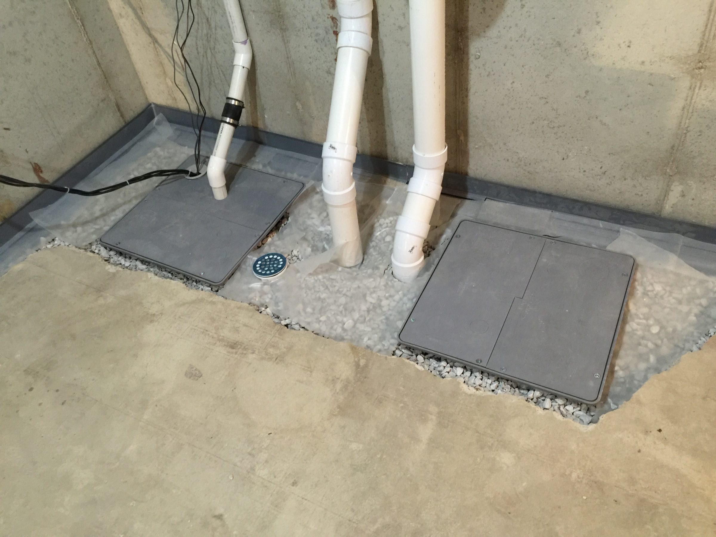 Basement sump pump system with PVC drainage pipes
