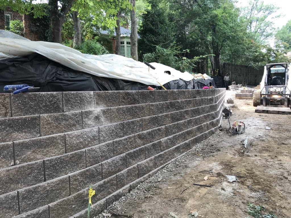 Concrete block retaining wall under construction