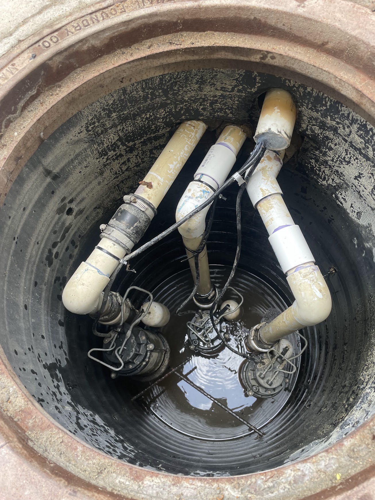 Submersible pumps and PVC pipes inside sump pit